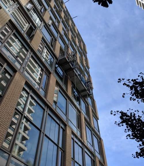 Building with sky background and scaffolding.