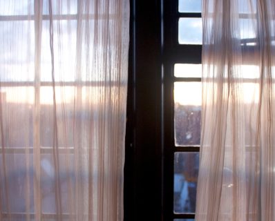 Sheer curtains with a sunrise view