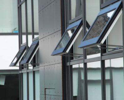 Open windows on modern building facade.