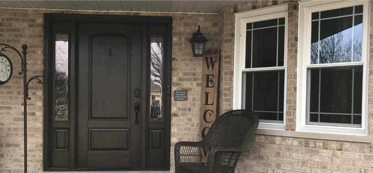 Front porch with chair and welcome sign