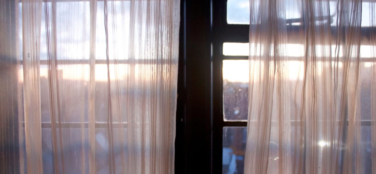 Sheer curtains with a sunrise view
