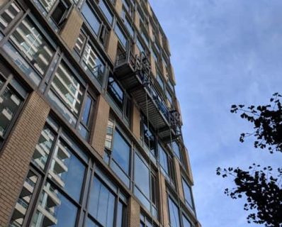 Building with sky background and scaffolding.