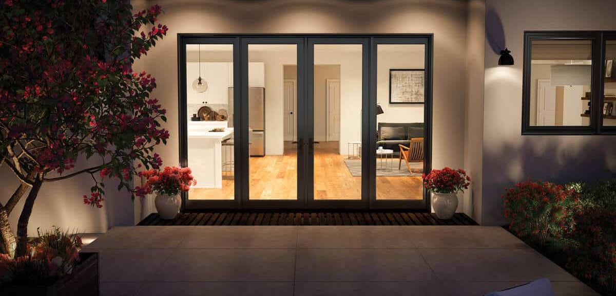 Modern home entrance with glass doors.