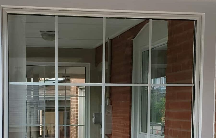 Reflection in a window with brick wall